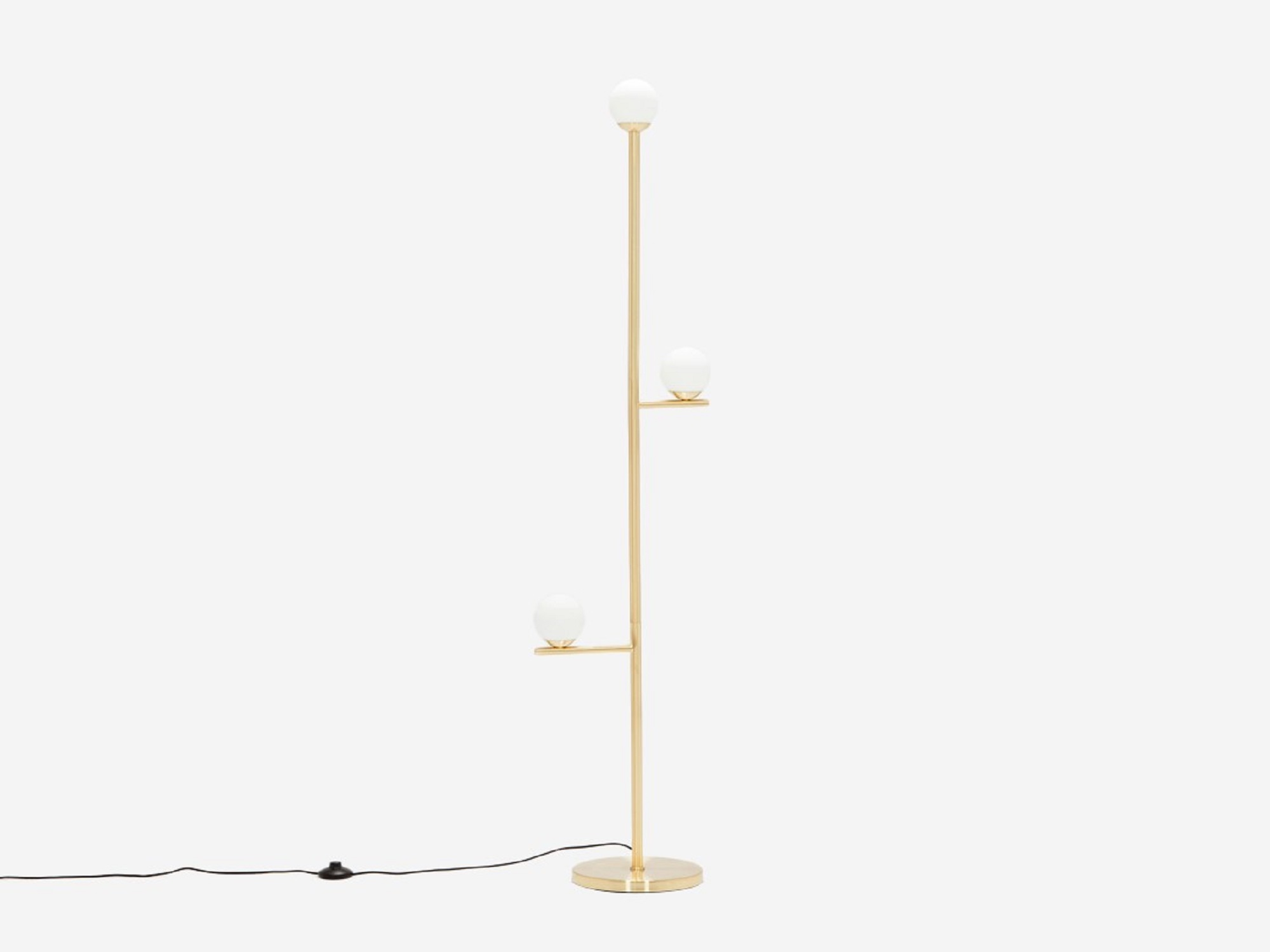 Front view of the Stem mid century floor lamp in brushed brass